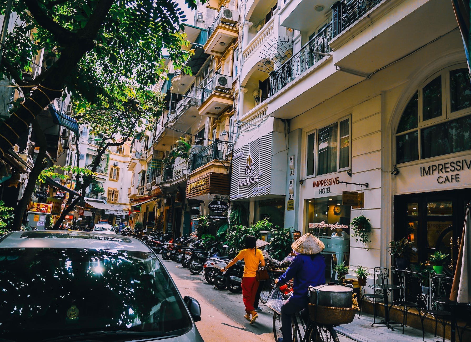 people walking in front of buildings